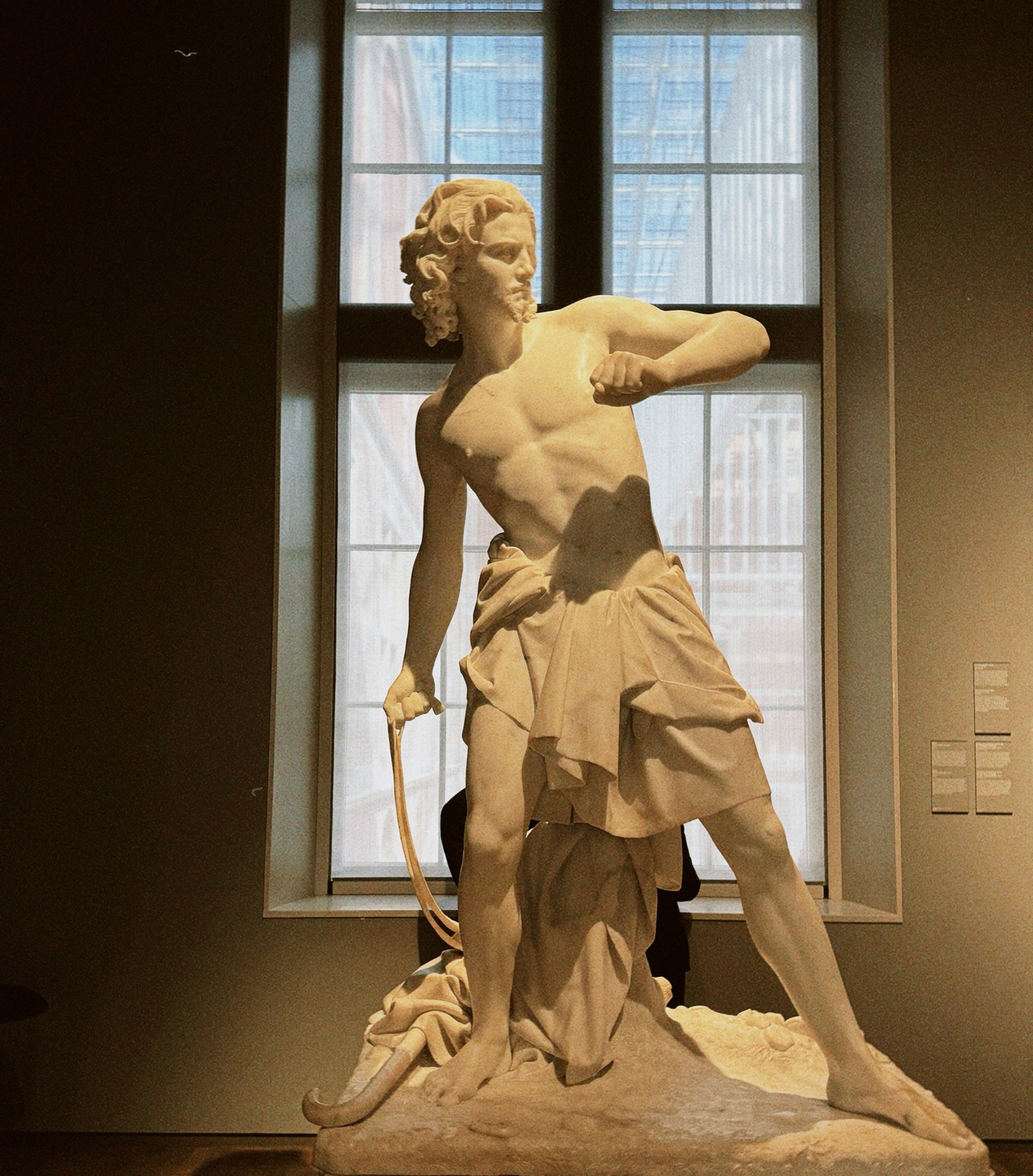 A historic sculpture displayed at the Rijksmuseum in Amsterdam, Netherlands.